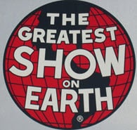 Vintage sign that reads "Greatest Show on Earth," symbolizes Barnum & Bailey & Bitcoin