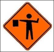 safer driving with warren buffett, symbolized by a roadside traffic sign for flagman