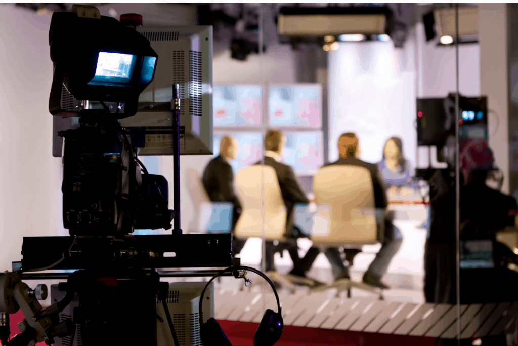 people in a tv studio, symbolizing why you won't see us on cnbc